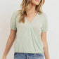 Textured knit surplice bottom string short sleeve top