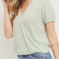 Textured knit surplice bottom string short sleeve top