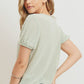 Textured knit surplice bottom string short sleeve top